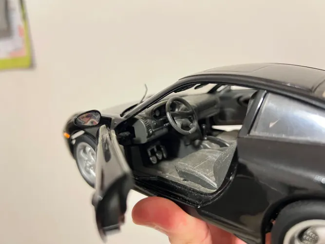 Miniatura 1:18 Porsche Carreira 911 Welly