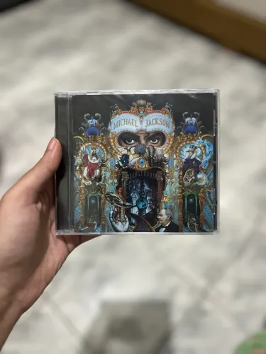 CD dangerous michael jackson lacrado