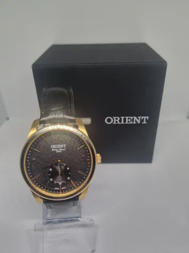 Relógio Orient quartz.