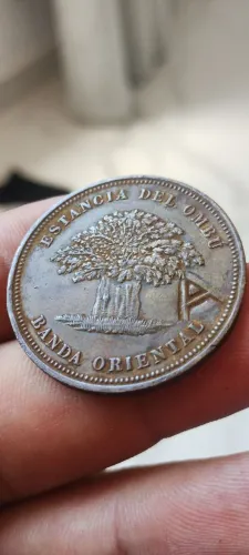 Moeda ficha estância del Ombu , primeiras moedas do Uruguai, peça não catalogada remarcada
