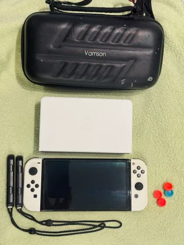 Nintendo switch OLED + película + protetores analógicos