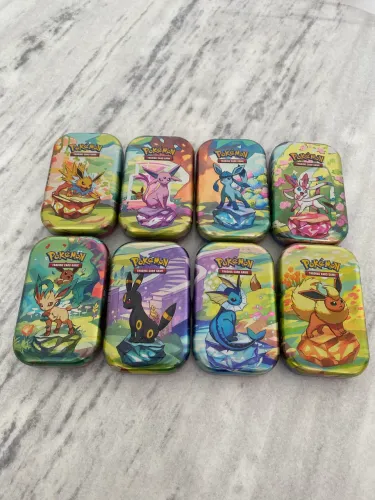 Conjunto mini tin evoluções prismáticas pokemon tcg (sem booster)
