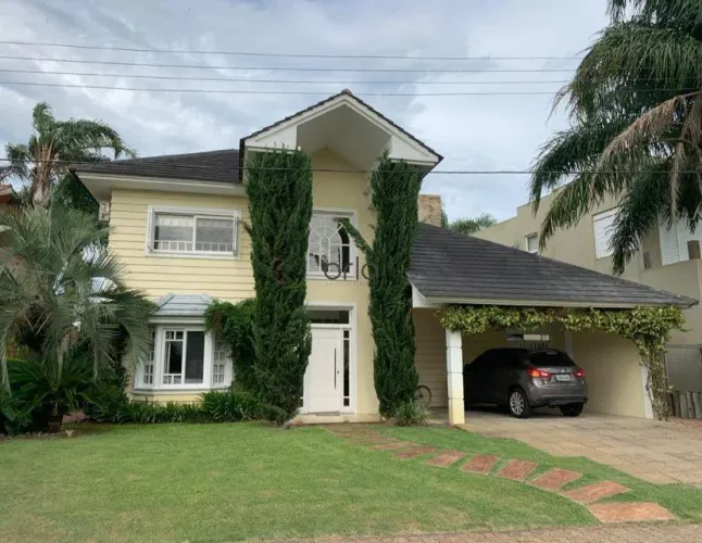 Casa beira lago com 4 suítes e piscina no Condomínio Atlântida Ilhas Park, Xangri-Lá REF: 
