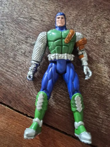 Boneco vintage do X-Cutioner Carl Denti da série "Mutant Genesis" da Toy Biz