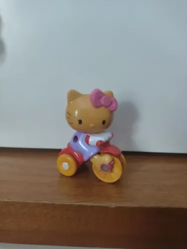 Miniatura boneca hello Kitty triciclo lacta original