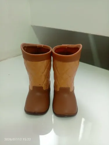 Boneca ogeneratio e a bota horiginal da boneca