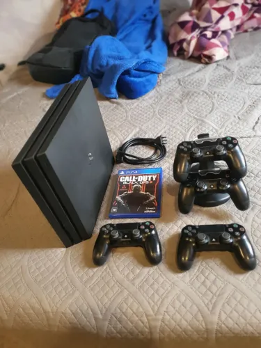 PS4 Pro Completo + 4 Controles + Jogo + Base de Carregamento