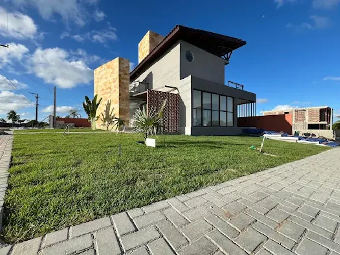 Casa com 4 dormitórios à venda, 181 m² por R$ 930.000,00 - Carapibus - Conde/PB