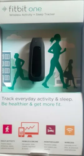 Fitbit One e seus acessórios para monitorar atividades fitness