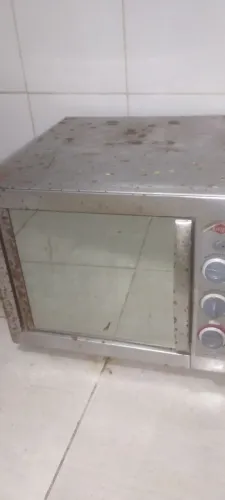 Fogão elétrico funcionando 100%rapido só ferrugem do lado de fora , baratinho
