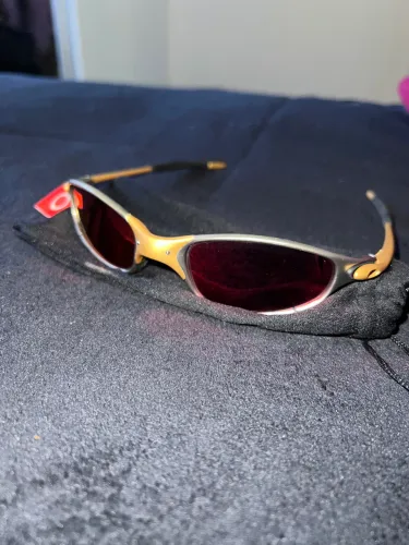 óculos oakley semi novo dourado com capa