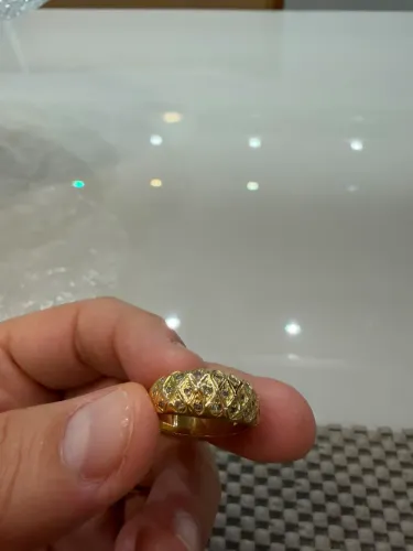 VENDO APARADOR OURO 18K750 COM PEDRAS.