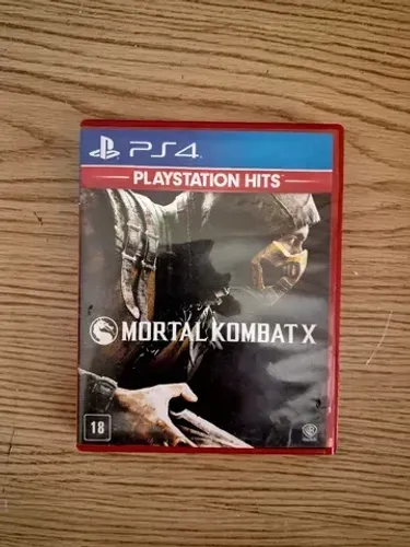 Mortal Kombat X para Playstation 4 PS4 na caixa com seus manuais.