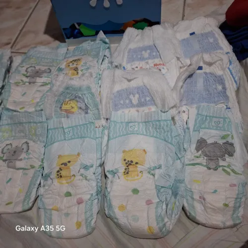  Fralda pampers + porta fraldas 