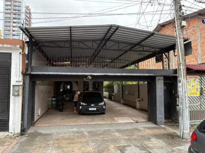 Casa de 2 pavimentos com 7/4 sendo 1 suíte + casa anexa de 2/4 sendo 1 suíte + garagem p/