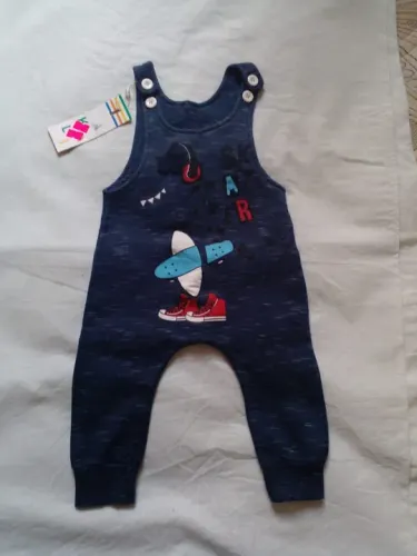 Macacão azul de bebe do dinossauro 