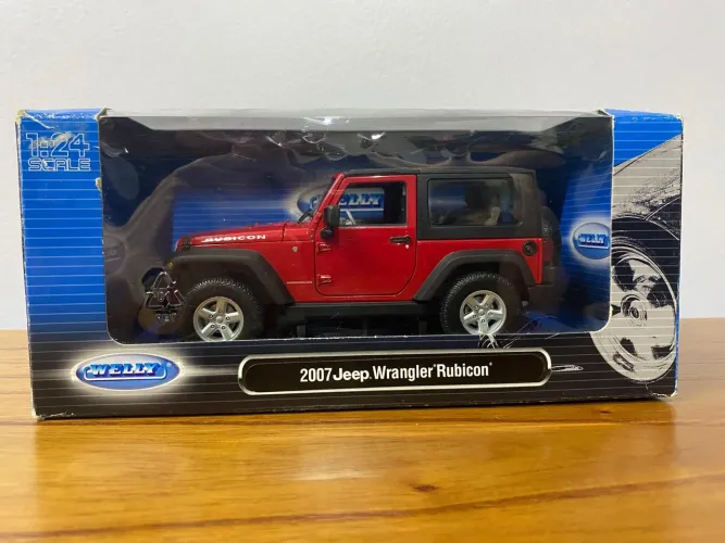 Mini Jeep Wrangler Rubicon 2007, vermelho. Marca Welly. Escala 1:24
