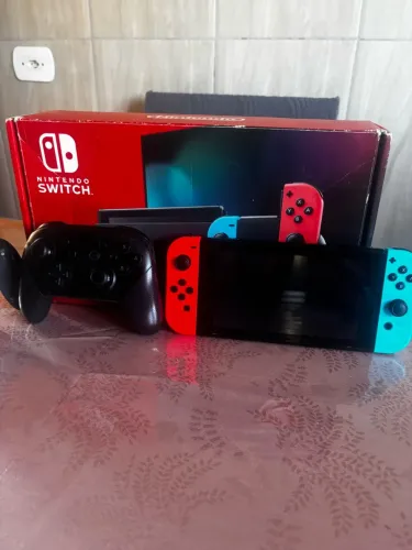 Nintendo switch + jogo Mário odssey e controle pro + case Mario 