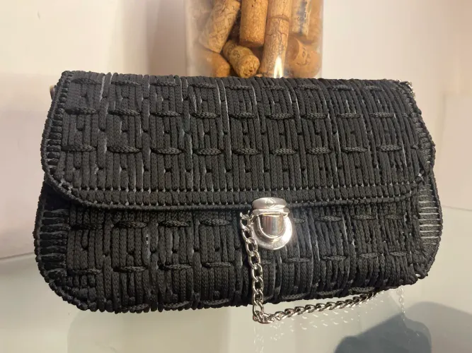Bolsa em a tela de tricô 