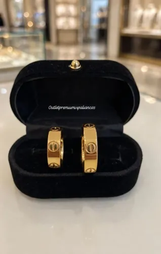 Par de aneis love cartier dourado 