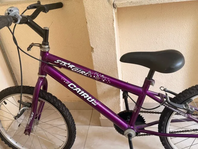 Vende bicicleta criança lilás