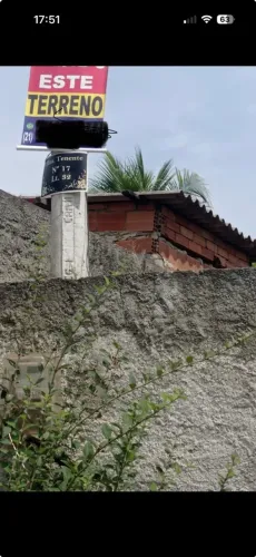 Vendo terreno todo murado, próximo a rua principal