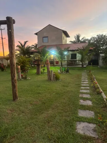 Casa estilo chalé rústico na praia