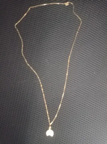 Corrente de ouro com pingente