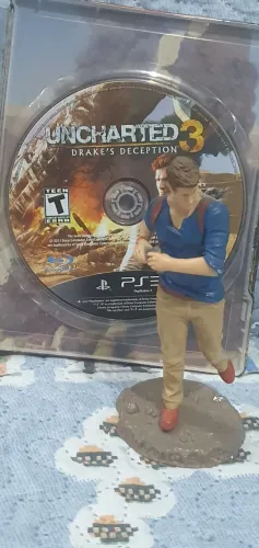 FIGURA DE AÇÃO BONECO UNCHARTED MAIS JOGO ORIGINAL EM STEELBOOK