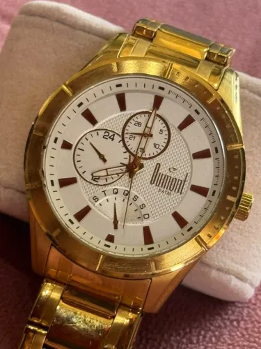 Relógio Dumont dourado com mostrador branco e submostradores