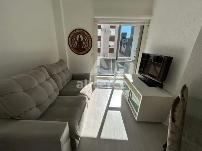 Apartamento 2 dormitórios com suíte, sacada com churrasqueira e vaga de garagem no Bairro
