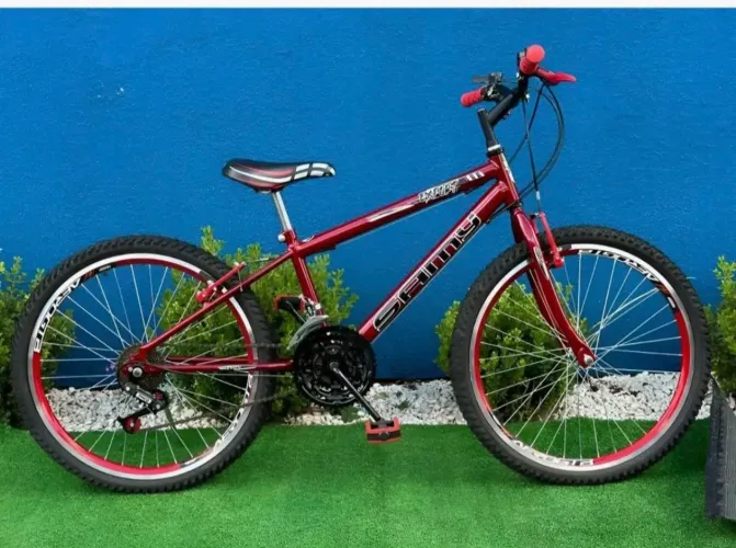 Vendo bicicleta vermelha aro 24 com 18 marchas sem uso