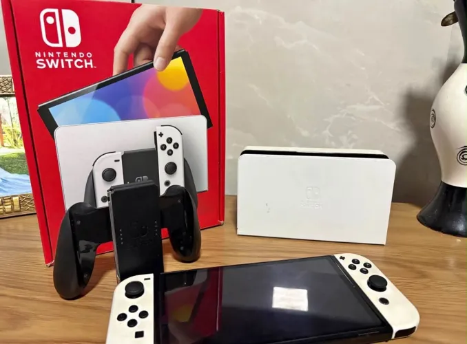 Nintendo Switch Oled na caixa + jogos Vendo e troco 