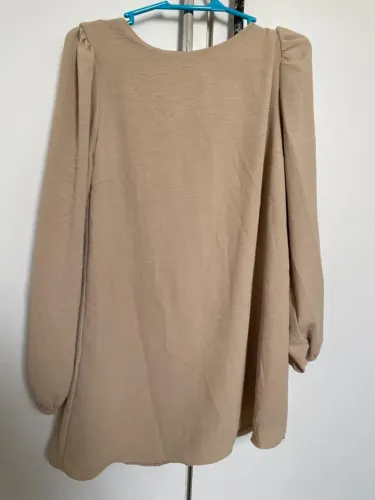 Vestido/short por baixo. Com manga