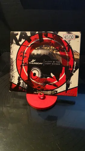 CD Thursday - a city by the light divided IMPORTADO
