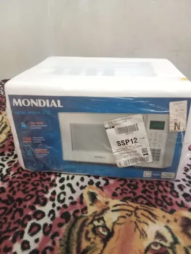 Vendo, microondas novo na caixa mondial 21 litros, motivo da venda comprar um gradr