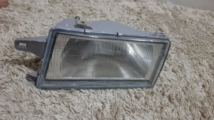 Farol Fiat Uno lado esquerdo original Arteb -1991 até 2004
