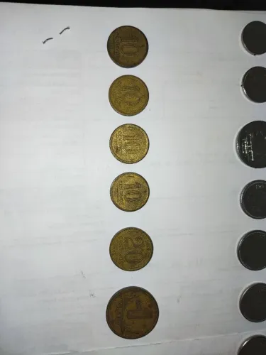 Moedas, células, cartões telefônicos 