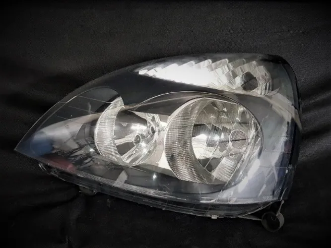 Farol Renault clio 03/06 Mascara negra Original