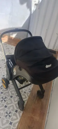 Carrinho com bebê conforto