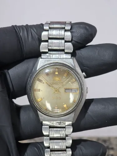 Relogio orient automatico com o mostrador maron 