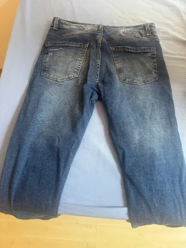 Jaqueta The North face e calça jeans
