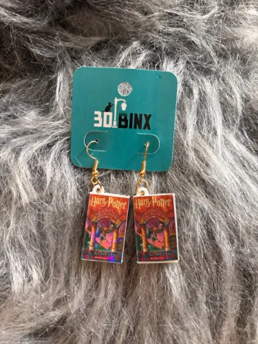Brincos holográficos dos livros de Harry Potter