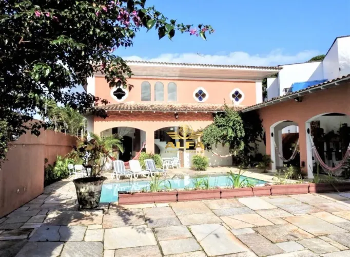 Casa com piscina e espaço gourmet na Praia de Pernambuco Alfa Imóveis Guarujá