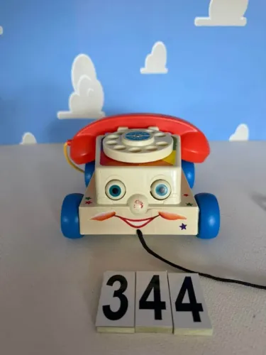 CHATTER TOY STORY FISHER PRICE, ESTA COM O NARIZ DESBOTADO
