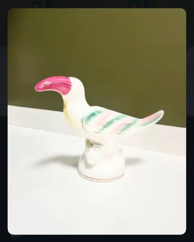 Pássaro vintage em porcelana esmaltada