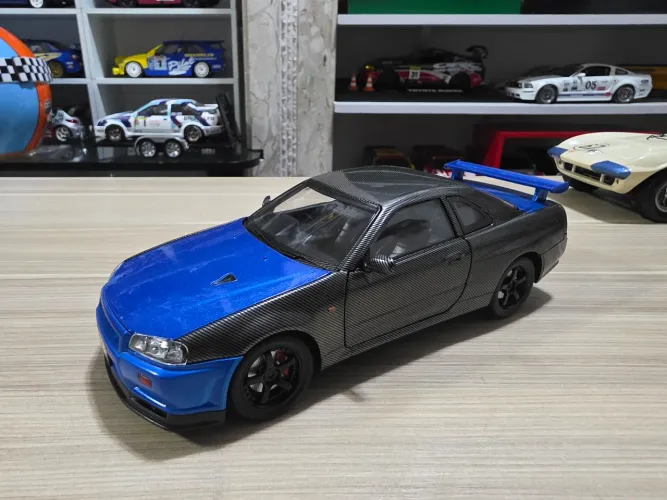 Miniatura 1.24 Nissan skyline gt-r34 edição carbon rara