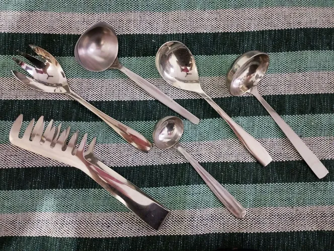 Conchas e pegador de macarrão em inox