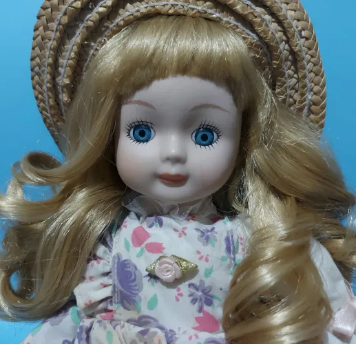 Boneca de Porcelana Antiga à corda ( Ler a descrição)