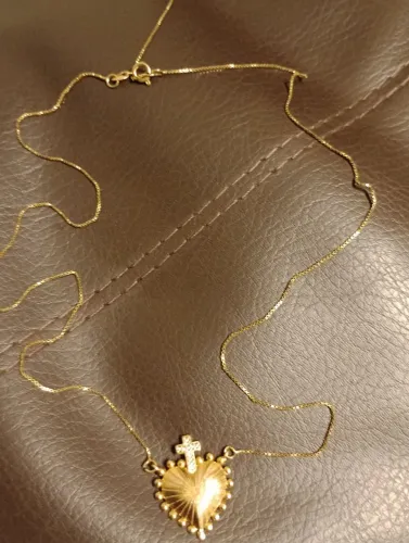 Vendo está corrente fina tijolinho com pingente 100 reais 